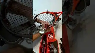 Stringing a tennis racket. Thrift store finds.
