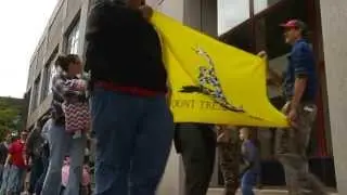 Gun advocates march with exposed firearms