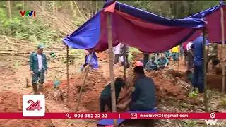 Khai quật lại vị trí an táng 12 liệt sỹ thanh niên xung phong | VTV24