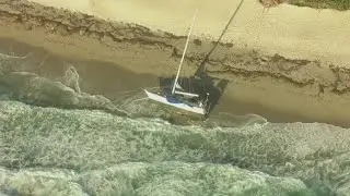 Chopper 5 above abandoned sailboat on Singer Island