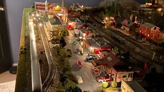 Model train layout wired with lights.