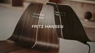 Discover the Fritz Hansen PK23&trade; Lounge Chair in Walnut | Original design by Poul Kj&aelig;rholm in 1954