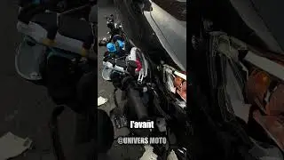 Beneath the front of the car, the scooter was reduced to a mangled mess.