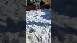 throwing snow at a firepit in slow motion