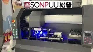 Watch the Cylindrical UV Printer customize cups with designs & text!