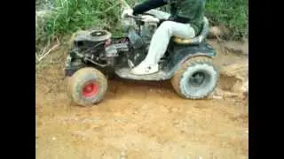 my brothers racing mower with new tires - mini mud hole