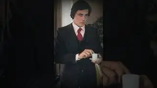 Alain DELON. Red tie.