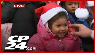 Kids and families of all ages talk excitement about seeing Santa at annual parade