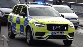 New City of London Police cars responding with siren and lights