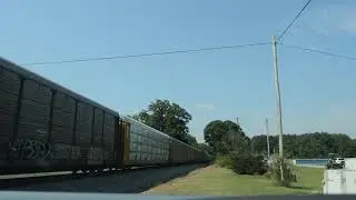 NS 9311 and NS 9528 lead an eastbound autorack train thru Choccolocco, AL
