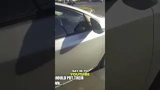 Caught on Camera Biker Challenges Woman Using Phone While Driving
