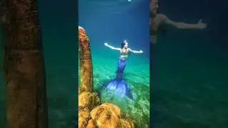 Mermaid princess puts on her tiara