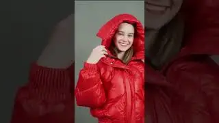 Red oversized puffy jacket with deep hood. Girl in red voluminous down jacket. Parka puffer jacket.