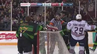 Ottawa 67's Goaltender Leo Lazarev delivers a big hit on Oshawa's Noel Serron