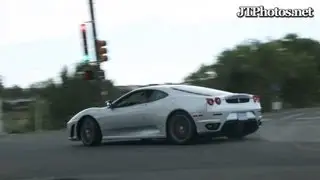 Ferrari F430 drifting through a traffic light