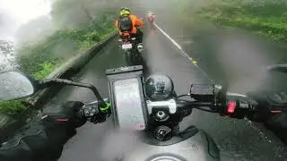 Trident 660 with other superbikes riding down the Thamarasserry Churam in heavy rain and fog