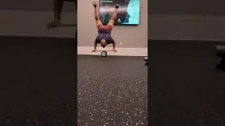 Practicing handstands on Indo Board
