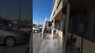Pressure washing stucco house, stairs, and walkways