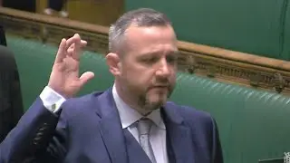 SNP MP Steven Bonnar crosses fingers during House of Commons swearing in ceremony