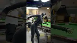 Chinese beauty playing billiards