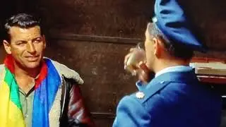Richard Egan educates Robert Mitchum on the current situation in Korea