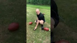 How to hold a football for a field goal attempt