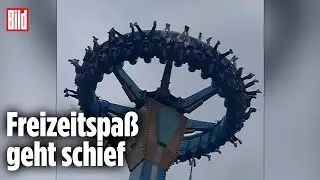 Karussell-G&auml;ste in China stecken kopf&uuml;ber in der Falle
