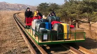 Russian diplomats leave North Korea on hand-powered rail trolley