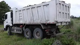 Dump truck - unloading of wet sand and stone