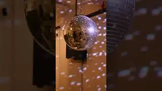 A beautiful disco ball, it creates a dynamic display of rotating light spots.