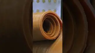 The process of mass-producing rubber bands. A rubber band manufacturing factory in Japan.