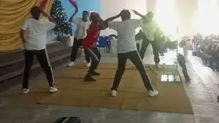 Idara leads her dance group at AFCS Carols 24