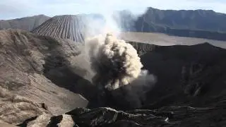 Morning crater-rim view of small ash cloud from Bromo volcano