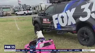 Cute NASCAR fan checks out FOX 35 Storm Team Thunder Truck