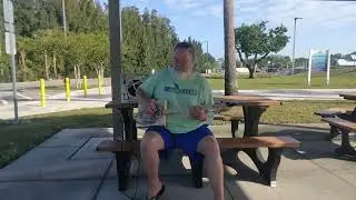 Box Guitar Playing Gator Country While Waiting In The Park
