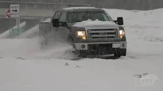 02-17-2021 El Dorado, AR - Heavy Snow, Cars Stuck on Spinning Tires, People Riding 4-Wheelers on Str