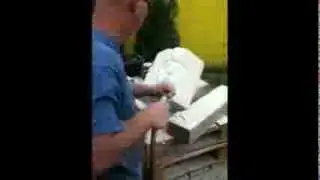 Art Wells Carving limestone face