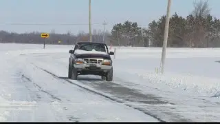 Rural road conditions after heavy snowfall