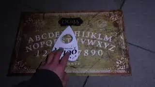Using A Ouija Board In A Graveyard On Halloween Night