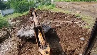 JCB moving big rock