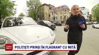 Doi polițiști de la Rutieră au fost prinși în flagrant când luau mită de la șoferi