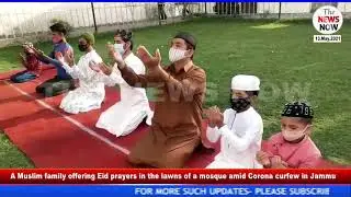A Muslim family offering Eid prayers in the lawns of a mosque amid Corona curfew in Jammu