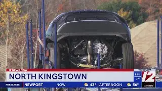 Driver injured after SUV slips off car carrier at Quonset