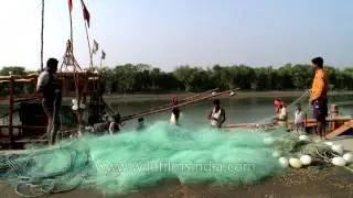 Fishermen with their nets at Frazerganj fishing harbour