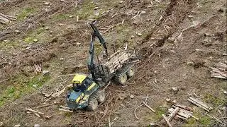 Ponsee Machine Picking Up Wood: Precision Logging Filmed by C&C Drone Services
