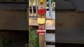 What to do with all those empty cat food cans - create a wind chime.