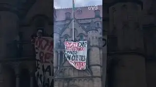 University of Manchester students unveil banner demanding an end to ties with the Israeli occupation