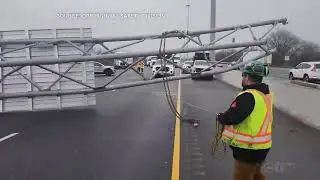 Fallen overpass sign lifted off Hwy 401 lanes in Whitby, Ontario