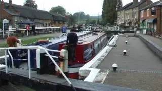 Canal barge going through the lock at Stoke Bruerne
