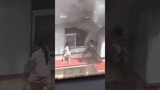 Desperate family crawl out of window to escape fire